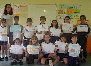 Students at Tomas de Berlanga showing their artwork